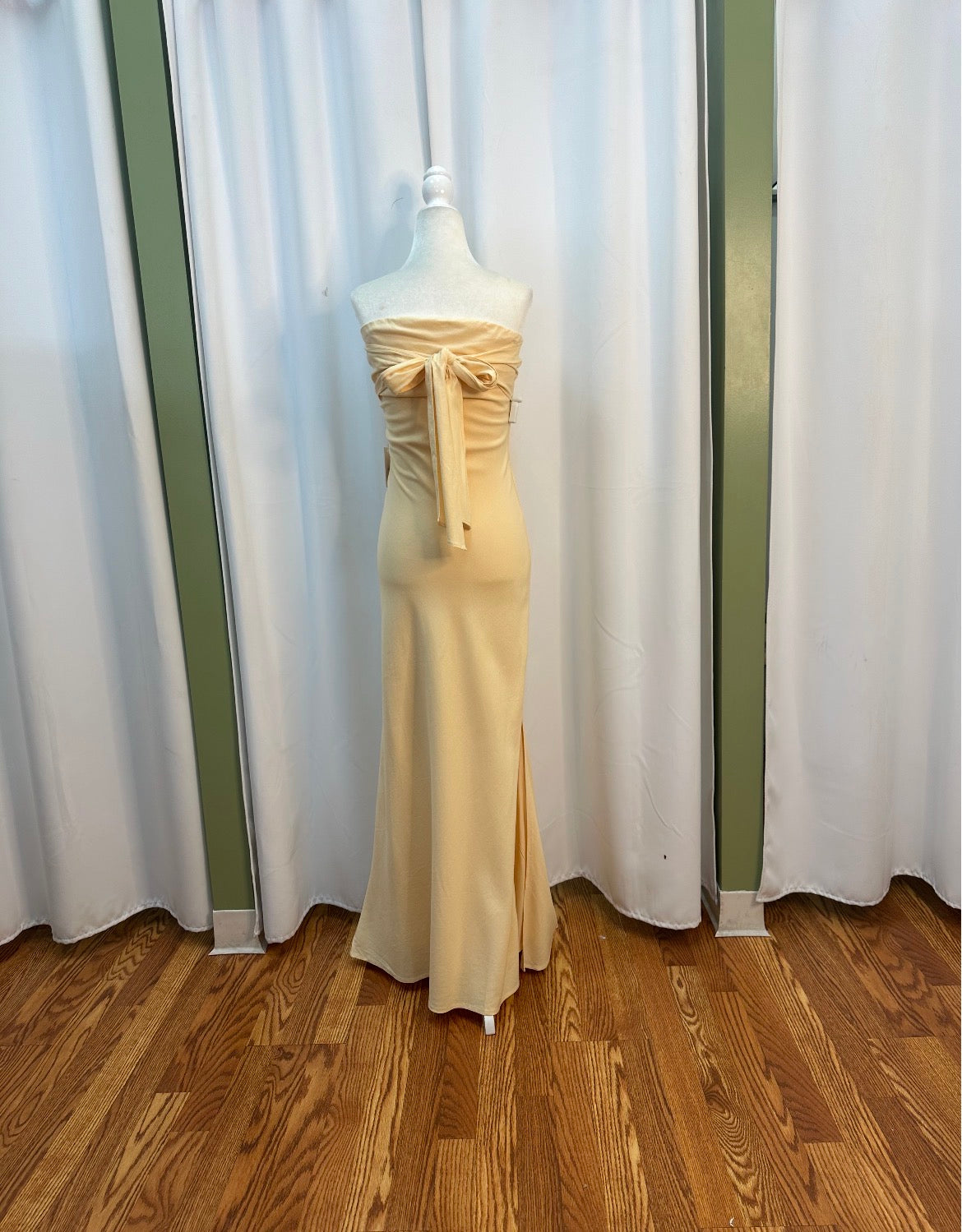 butter yellow strapless stretch flowy material, bow designed back.