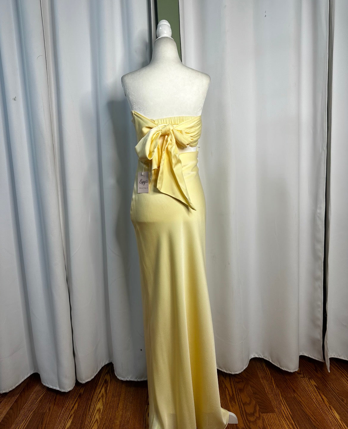 yellow satin, strapless bow tied back long elegant beautiful dress.