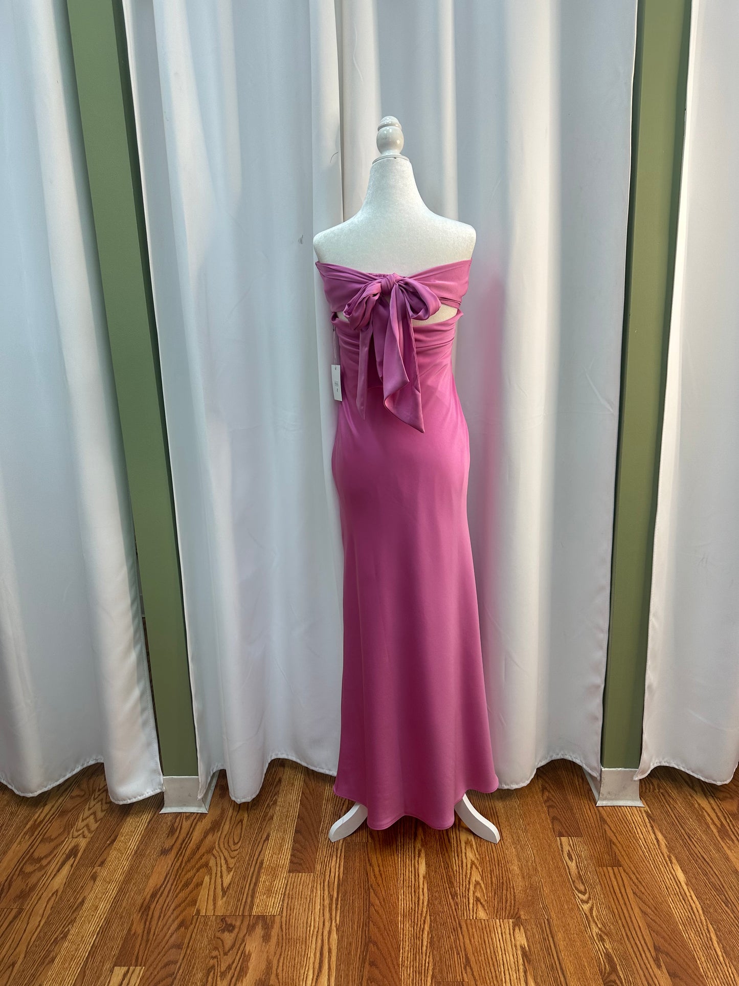 long pink satin dress with bow on the back