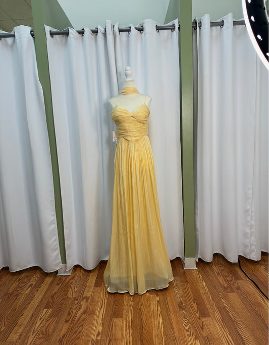 chiffon yellow long scarf neck dress aligned with halter straps back design.