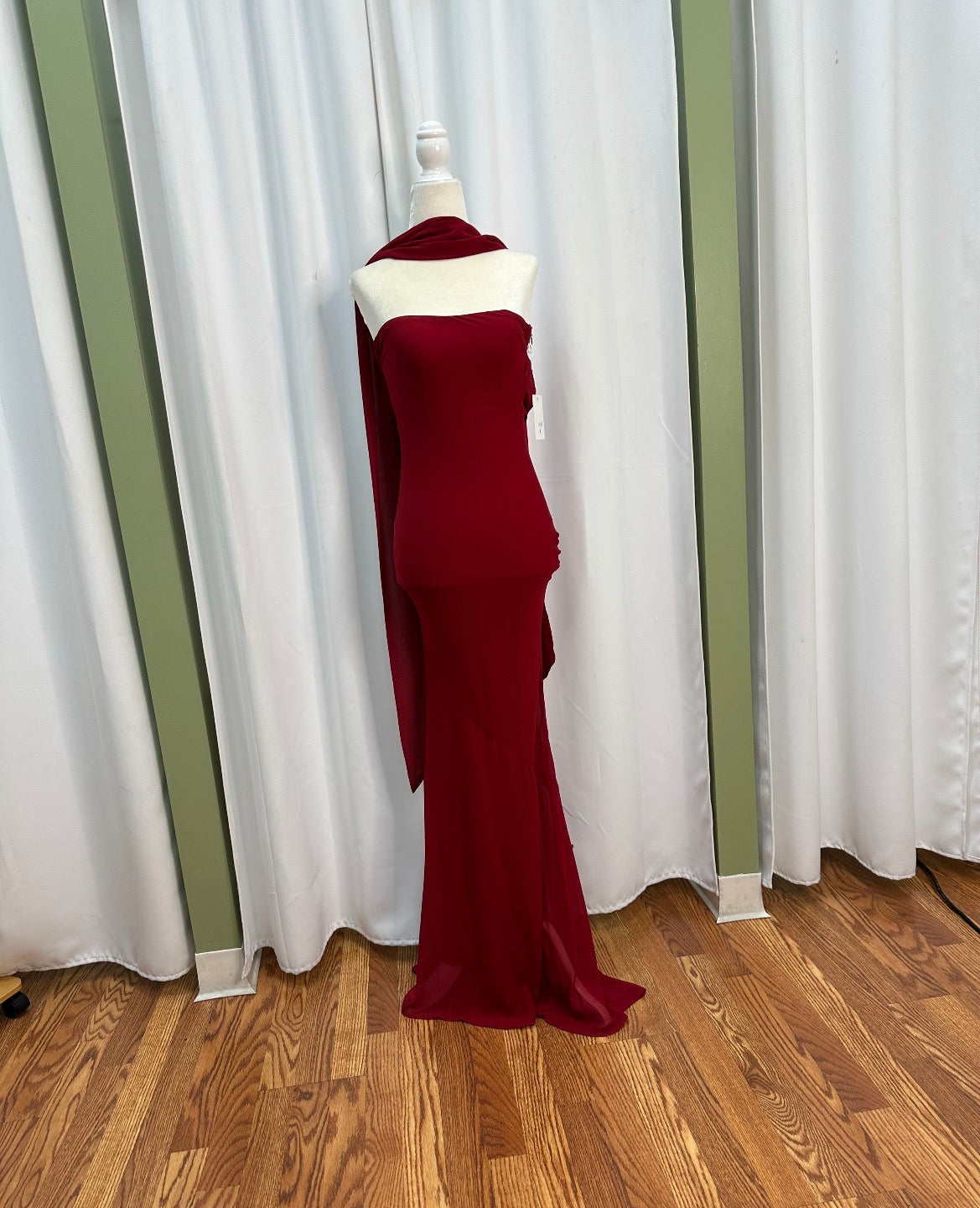Crimson long elegant strapless dress, open back.