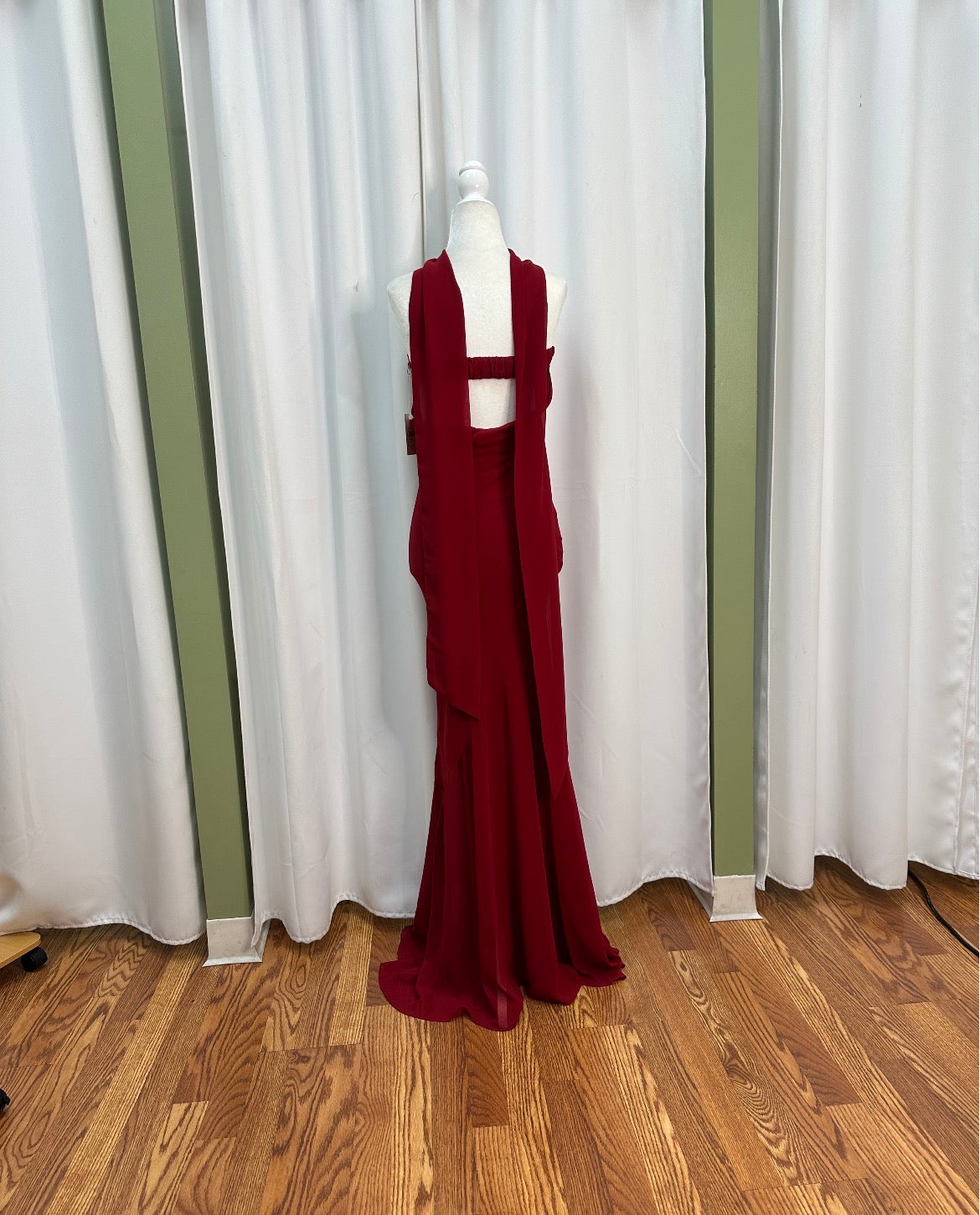 Crimson long elegant strapless dress, open back.
