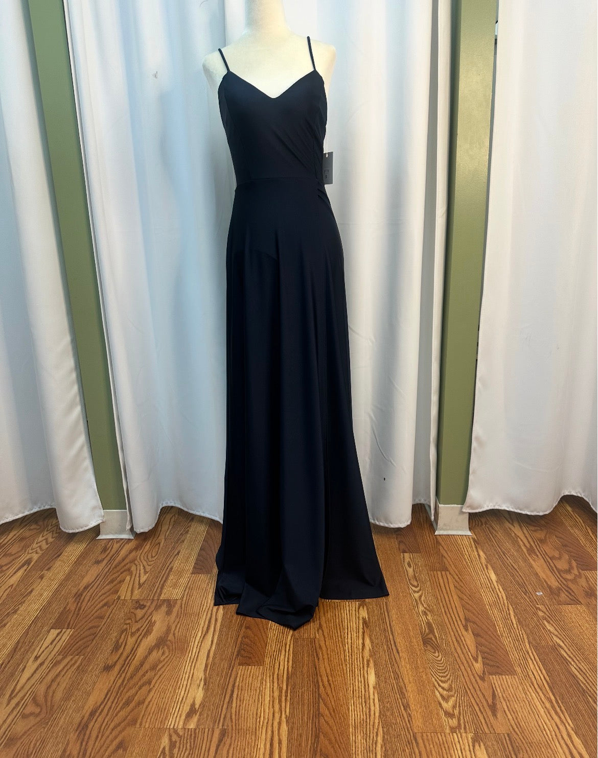 navy blue stretch material dress, open back design.