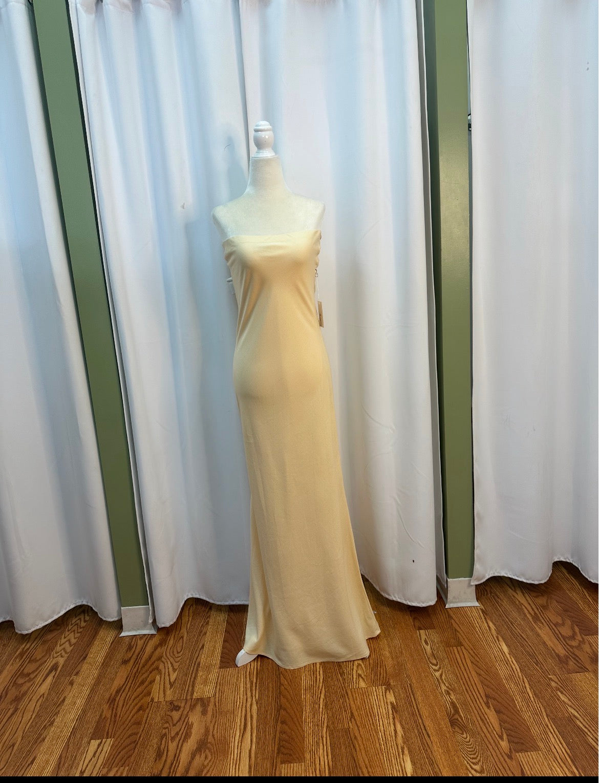 butter yellow strapless stretch flowy material, bow designed back.