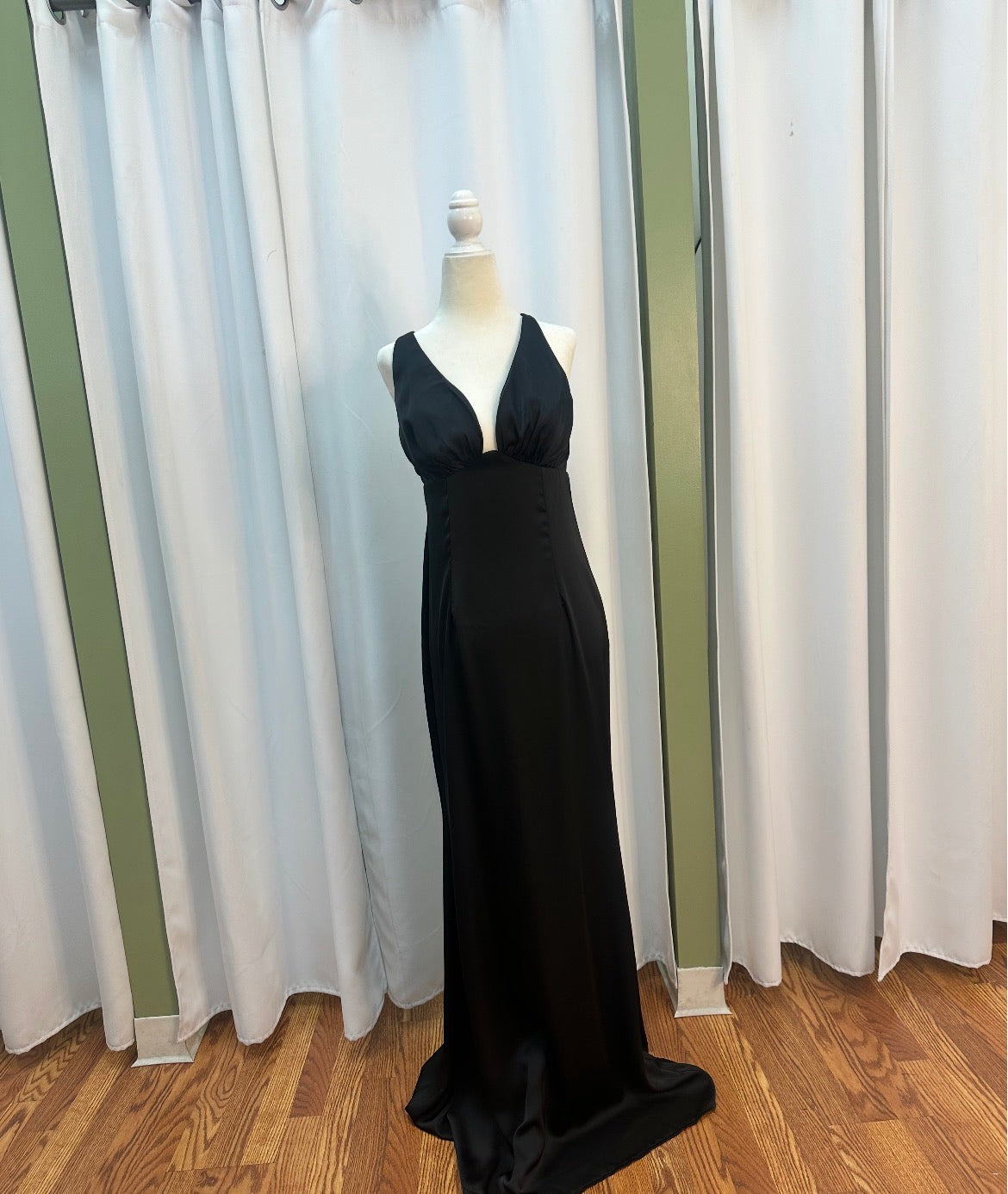 Satin black dress, open back design.