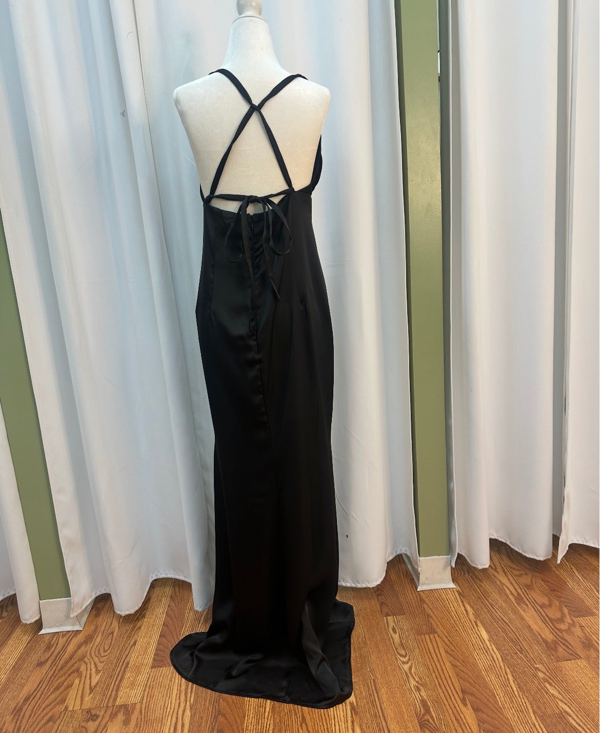 Satin black dress, open back design.