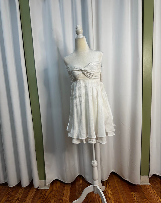 white short layered dress, bow design upfront open back.