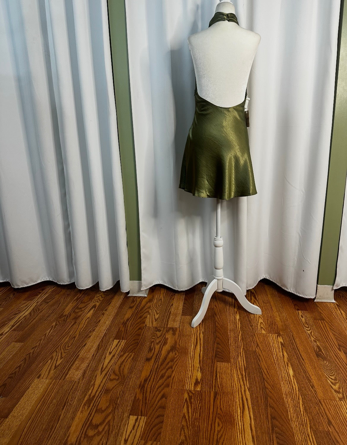 Green satin short turtleneck dress open back.