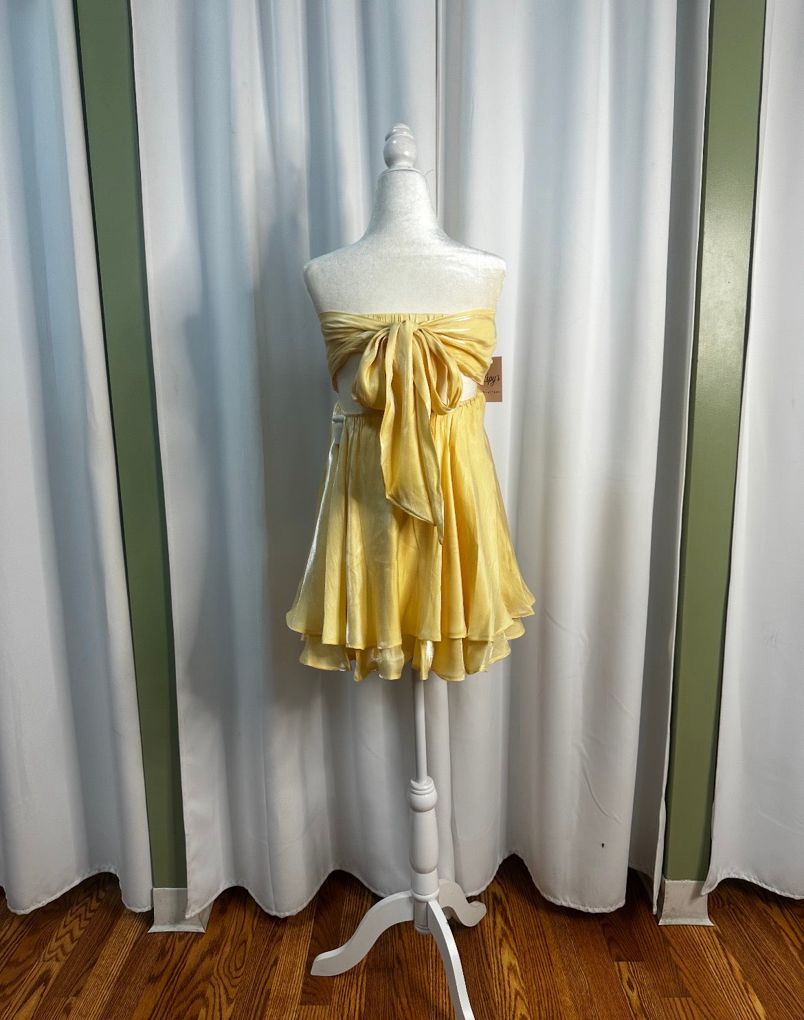 yellow short layered dress, bow design upfront, openback.